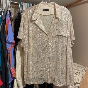 Silver sequins on nude mesh short sleeve snap up shirt.